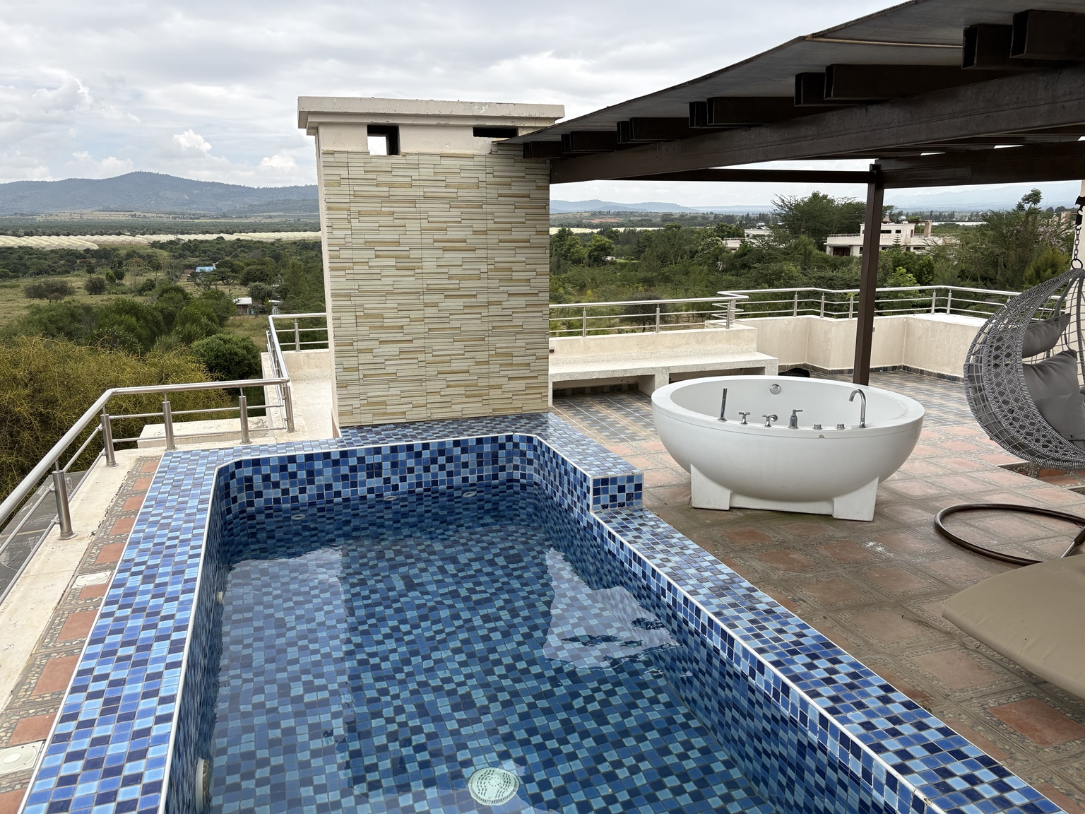 Rooftop pool and jacuzzi with panoramic views