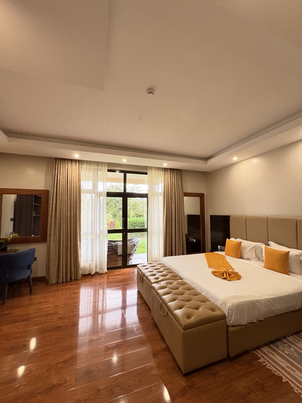 Villa 54 Deluxe Room with solid yellow bed runner