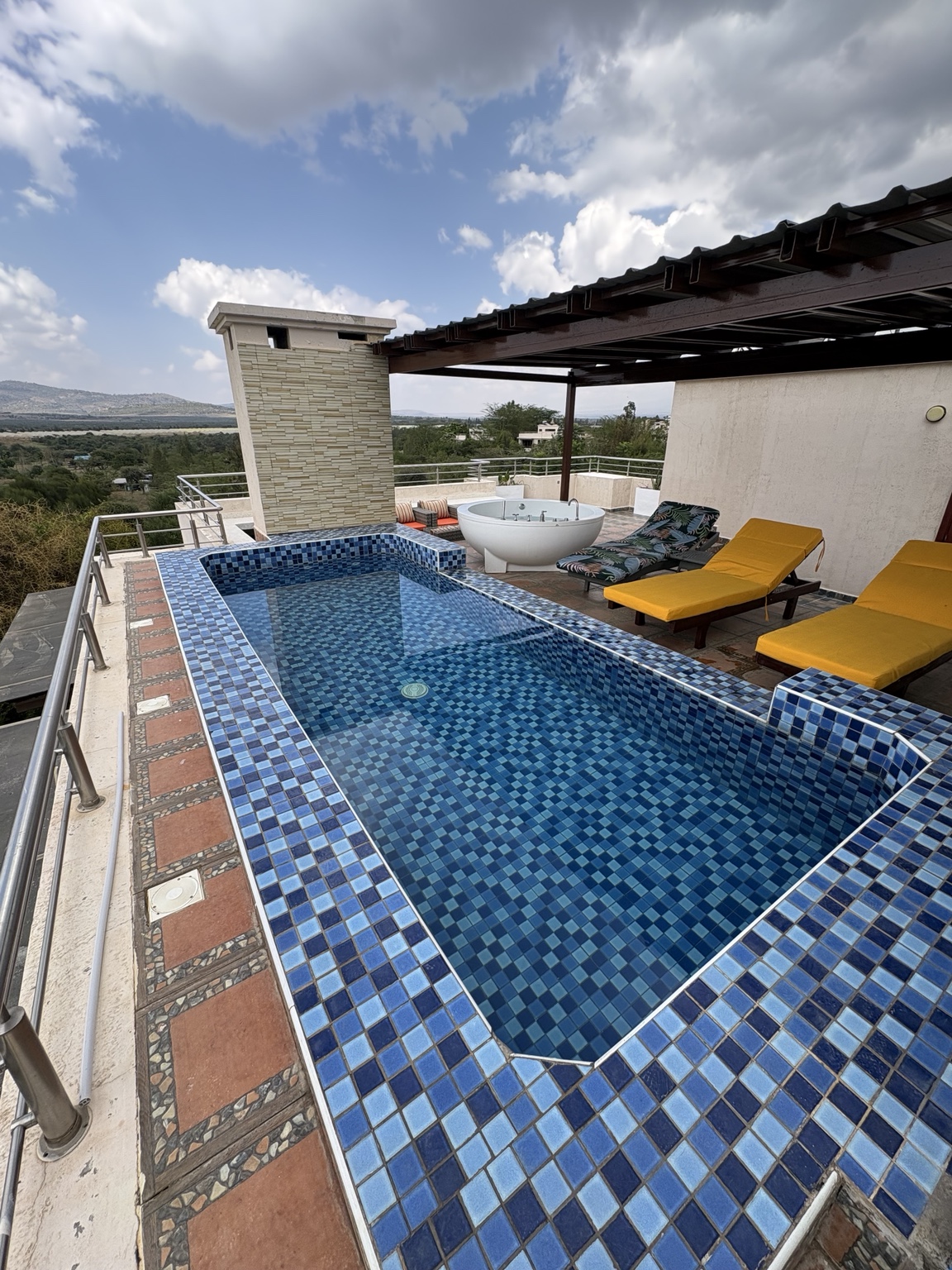 Rooftop pool and jacuzzi with views